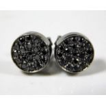 A pair of 18ct white gold earrings with black rhod