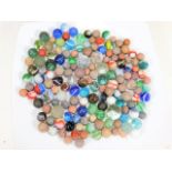 A bagged quantity of vintage marbles, including st