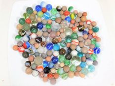A bagged quantity of vintage marbles, including st