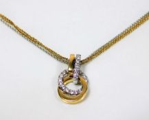 An 18ct two tone necklace & diamond set pendant 11