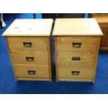 A pair of modern pine bedside cabinets