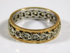 A 9ct two tone gold eternity ring set with white s