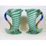 A pair of Clarice Cliff cornucopia jugs 8.75in