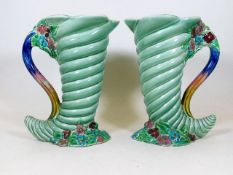 A pair of Clarice Cliff cornucopia jugs 8.75in