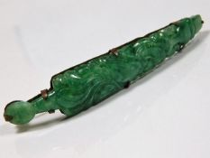 An antique Chinese carved jade hair piece
