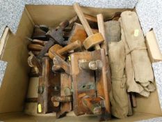 A boxed quantity of wooden planes, marking gauges