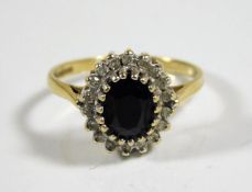 A 9ct gold ring set with diamonds & sapphire 3.3g