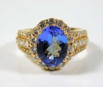 A 14ct gold ring encrusted with white diamonds & s