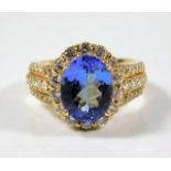 A 14ct gold ring encrusted with white diamonds & s