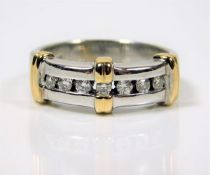 A 10ct two tone gold ring set with diamonds 4.6g s