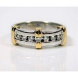 A 10ct two tone gold ring set with diamonds 4.6g s