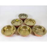 A set of six silver on copper Tibetan bowls