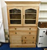 A 19thC. pine kitchen dresser with glazed cupboard