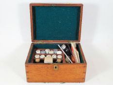 An antique boxed blood taking set