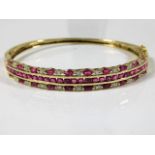 A 9ct gold bangle set with ruby & diamond 12.3g