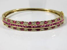 A 9ct gold bangle set with ruby & diamond 12.3g