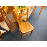 An early 20thC. childs elm school chair