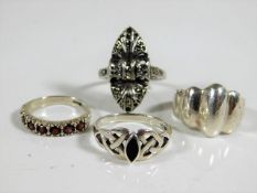 A silver Celtic ring & three other silver rings