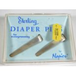 A pair of Napier silver diaper pins