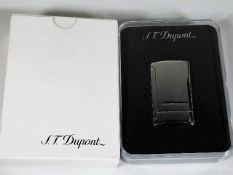 A boxed as new S. T. Dupont lighter