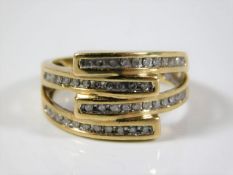 A 9ct gold designer style ring set with diamond 5.