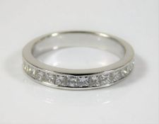An 18ct white gold ring set with 1.1ct of princess