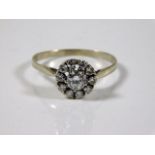 A white metal antique daisy style diamond ring set 2g size R