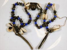 A 19thC. African tribal art fertility necklace wit