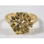 A yellow metal ring of organic form, tests as 18ct