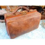 A leather Gladstone style bag