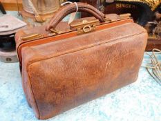 A leather Gladstone style bag