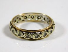 A 9ct gold two tone eternity ring set with white s