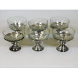 A set of six silver mounted dessert dishes, some f