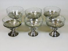 A set of six silver mounted dessert dishes, some f