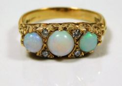 A Victorian 18ct carved gold ring set with opal &