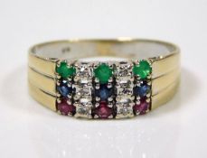 An 18ct gold ring set with three emeralds, sapphir