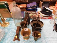 Four mortar & pestles, one mortar, a copper jug &