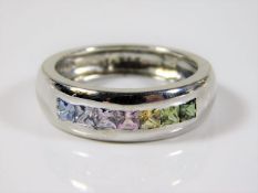 An 18ct white gold ring by A & W set with rainbow