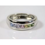 An 18ct white gold ring by A & W set with rainbow