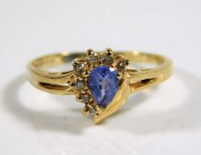 A 9ct gold ring set with diamond & cornflower blue