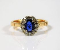 An 18ct gold ring set with diamond & sapphire 3.3g