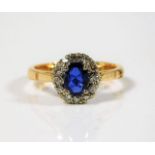 An 18ct gold ring set with diamond & sapphire 3.3g