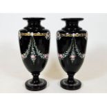 A pair of late 19thC. deep purple glass vases with