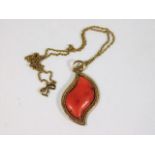 A Victorian yellow metal mounted coral pendant on