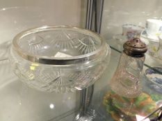 A silver rimmed salad bowl twinned with silver top