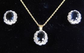 A ladies 9ct gold earring & necklace set set with
