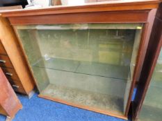 An antique glass display cabinet from Looe's Dowli