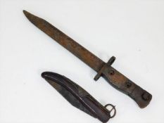 A military bayonet twinned with an Asian style fol
