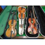 Three vintage violins as found with three bows