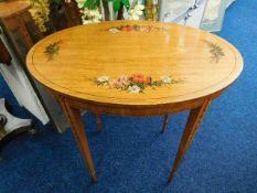 A satinwood table with tapered legs & organic deco
